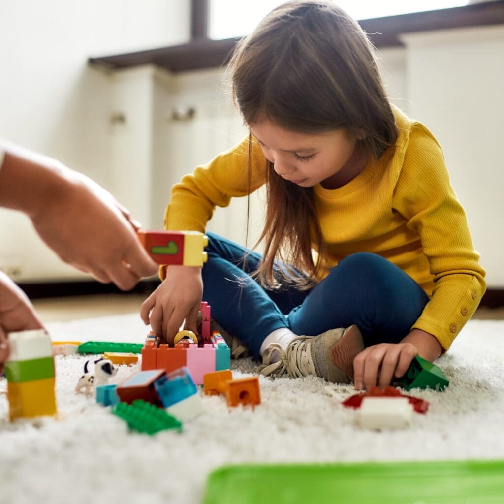 Young child engaging in play and development support through the Early Childhood Services program